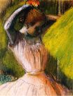 Edgar Degas - Dancer arranging her hair 1902