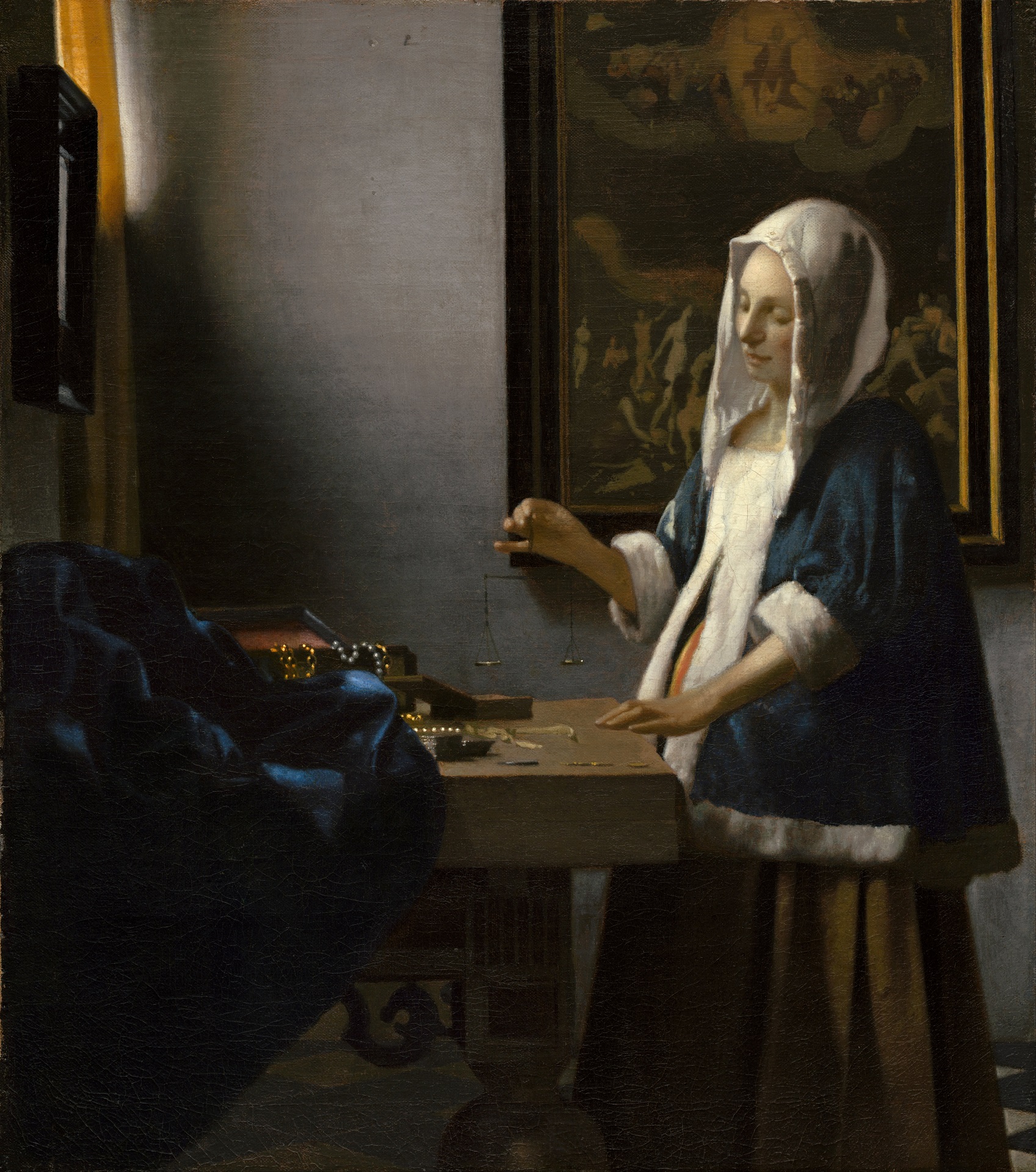 Johannes Vermeer - Woman Holding a Balance 1665