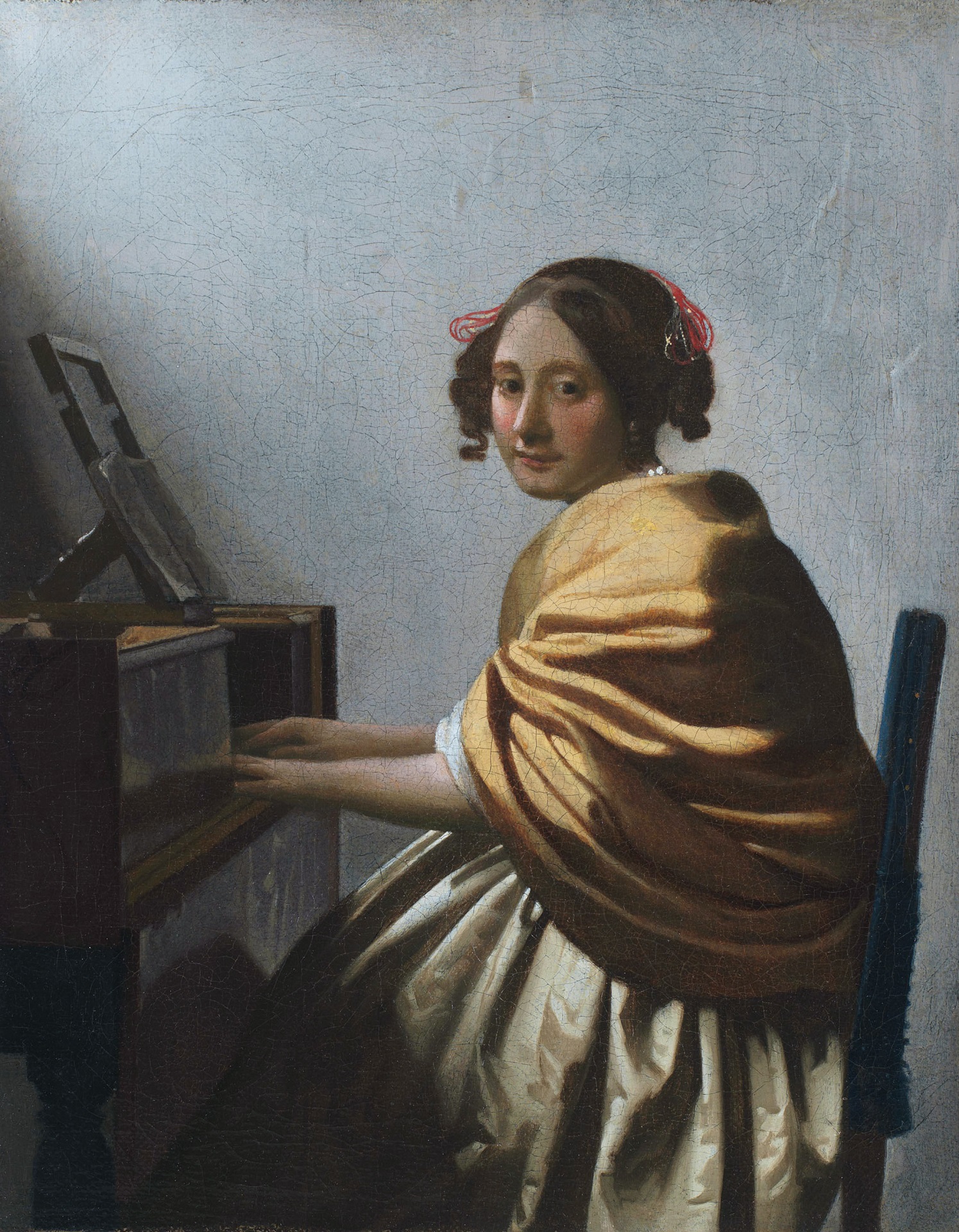 Johannes Vermeer - A young woman seated at the virginals. A young woman seated at the virginal 1670-1672