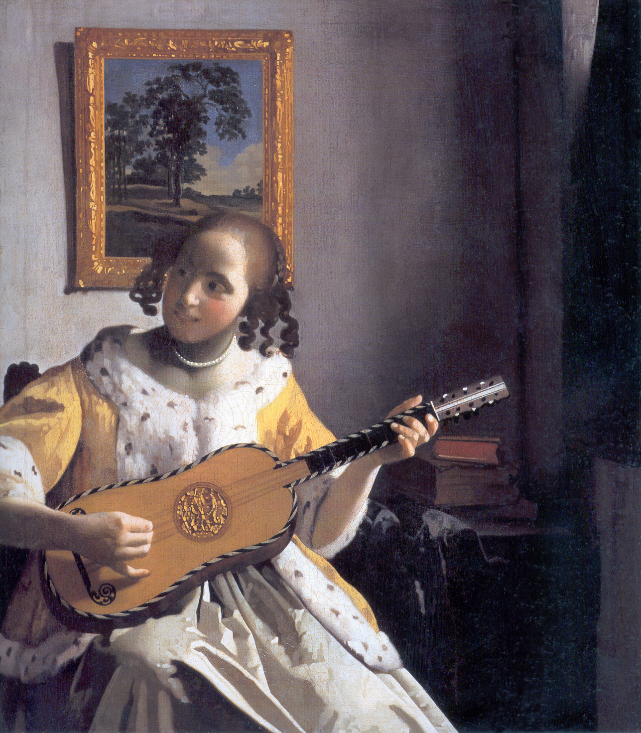 Johannes Vermeer - The Guitar Player. Young woman playing a guitar 1670-1672
